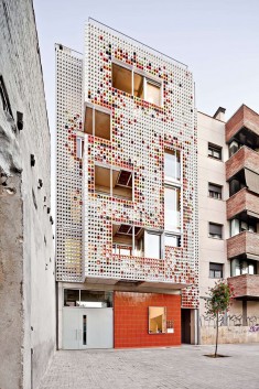 A Facade Of Colorful Ceramic Blocks Cover This Apartment Building
