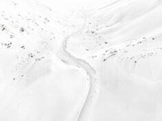 Stunning aerial image of snow covered Swiss mountains by Tom Hegen.