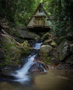 This is the coolest A-frame I have ever seen. The creek flows directly underneath the cabin. On  ...