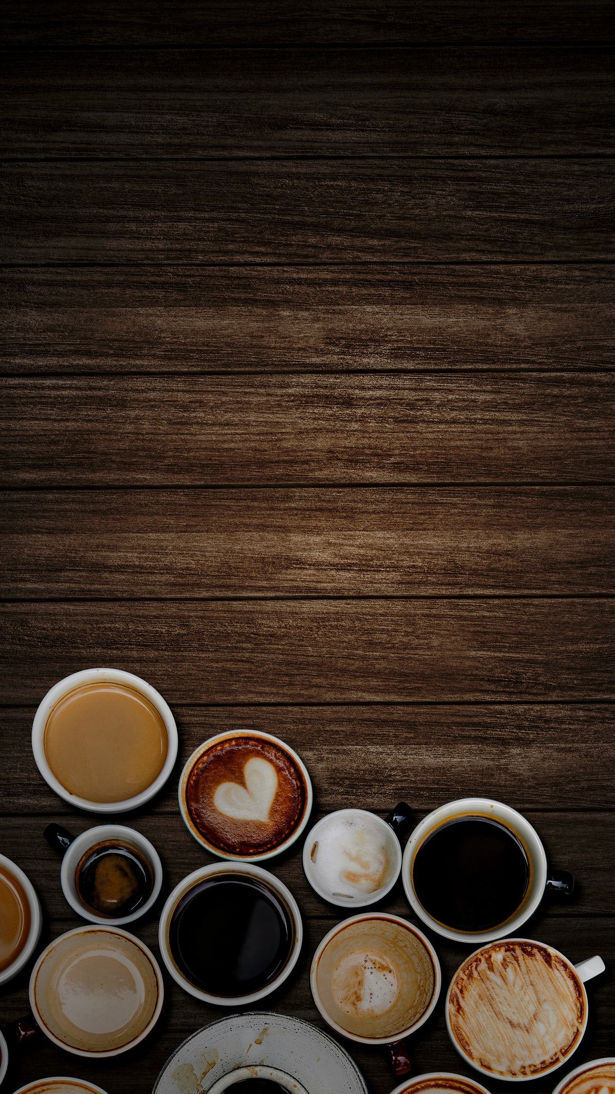 Download free image of Various coffee cups on a dark brown wooden textured background by nook ab ...