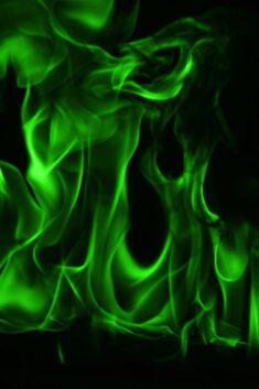 Premium Photo | Abstract green fire flames on black background