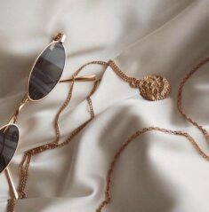 GOLD SUNGLASSES WITH A GOLD CHAIN