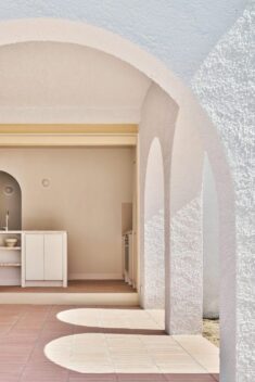 Arched openings connect indoor and outdoor spaces in 1960s Spanish holiday home