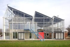 Steel-and-glass “greenhouse” envelops existing buildings at Paddenbroek Education Centre