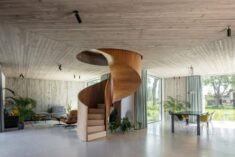 OYO Architects positions spiral staircase at the heart of brick and concrete House Dede