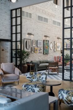 Trilogy Montgomery’s airy lobby features whitewashed brick walls and eclectic furniture