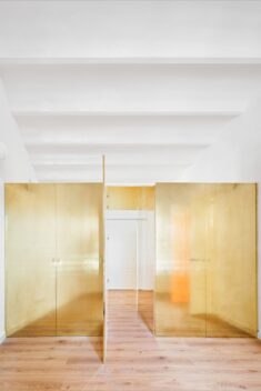 Golden wardrobe forms focal point of The Magic Box Apartment in Spain