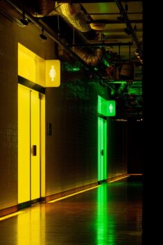 Tile-clad Tokyo toilets are drenched in bright green and yellow light