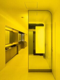 Tile-clad Tokyo toilets are drenched in bright green and yellow light