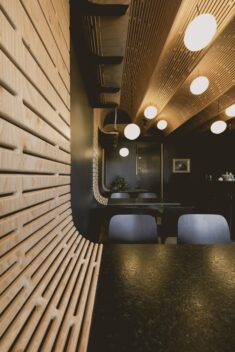 Studio North adds plywood barrel vaults to Business & Pleasure bar