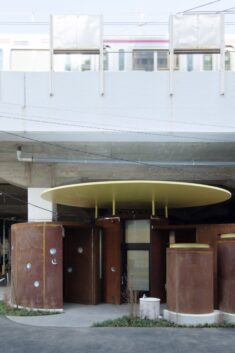 Junko Kobayashi tops weathering-steel Tokyo toilet with bright yellow disc