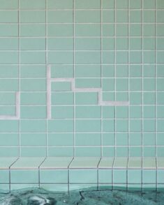 Schemata Architects clads Komaeyu bathhouse in “patchwork” of turquoise tiles