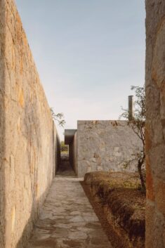 HW Studio divides a rural Mexican house with large stone walls